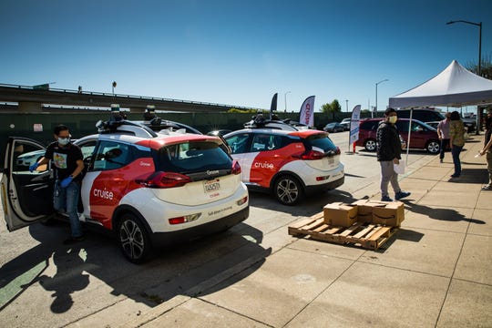Carmakers push forward on EVs as self-driving hits pandemic speed bumps