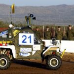 The Autonomous-Car Chaos of the 2004 Darpa Grand Challenge